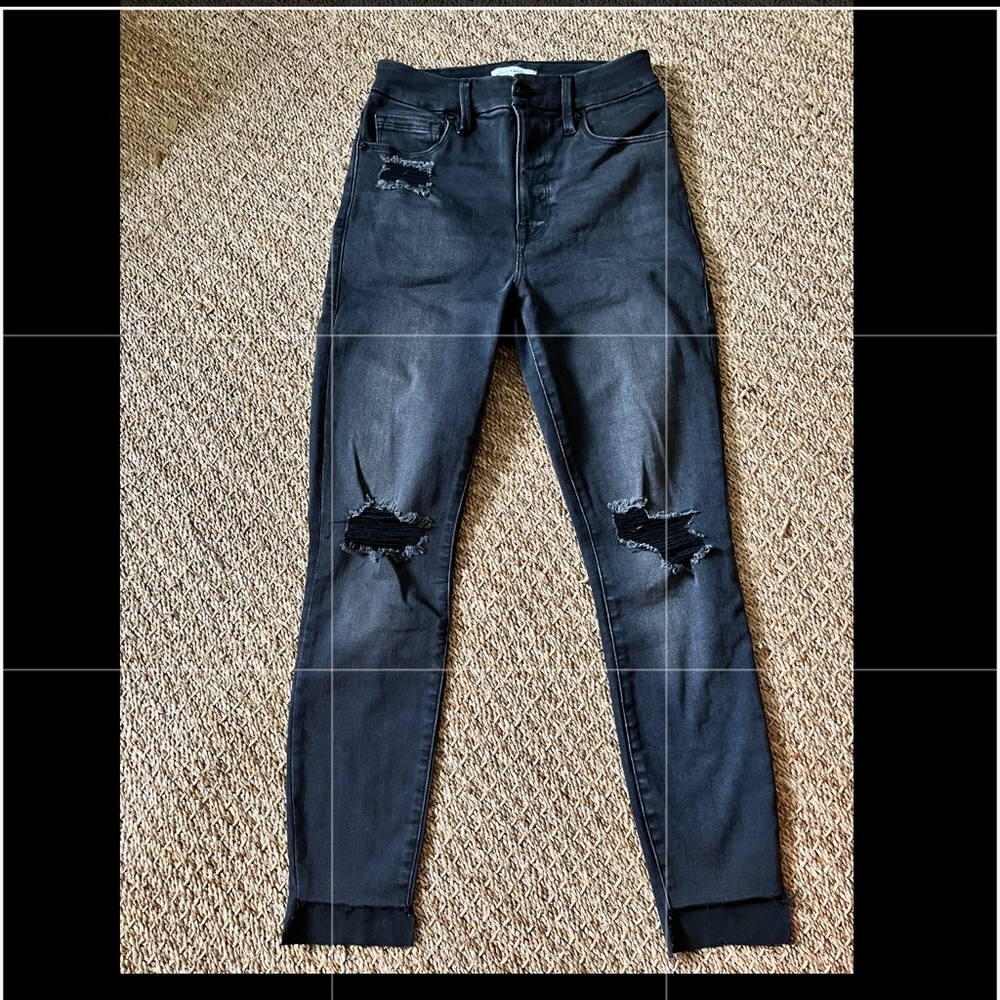 Distressed good American step hem skinny jeans